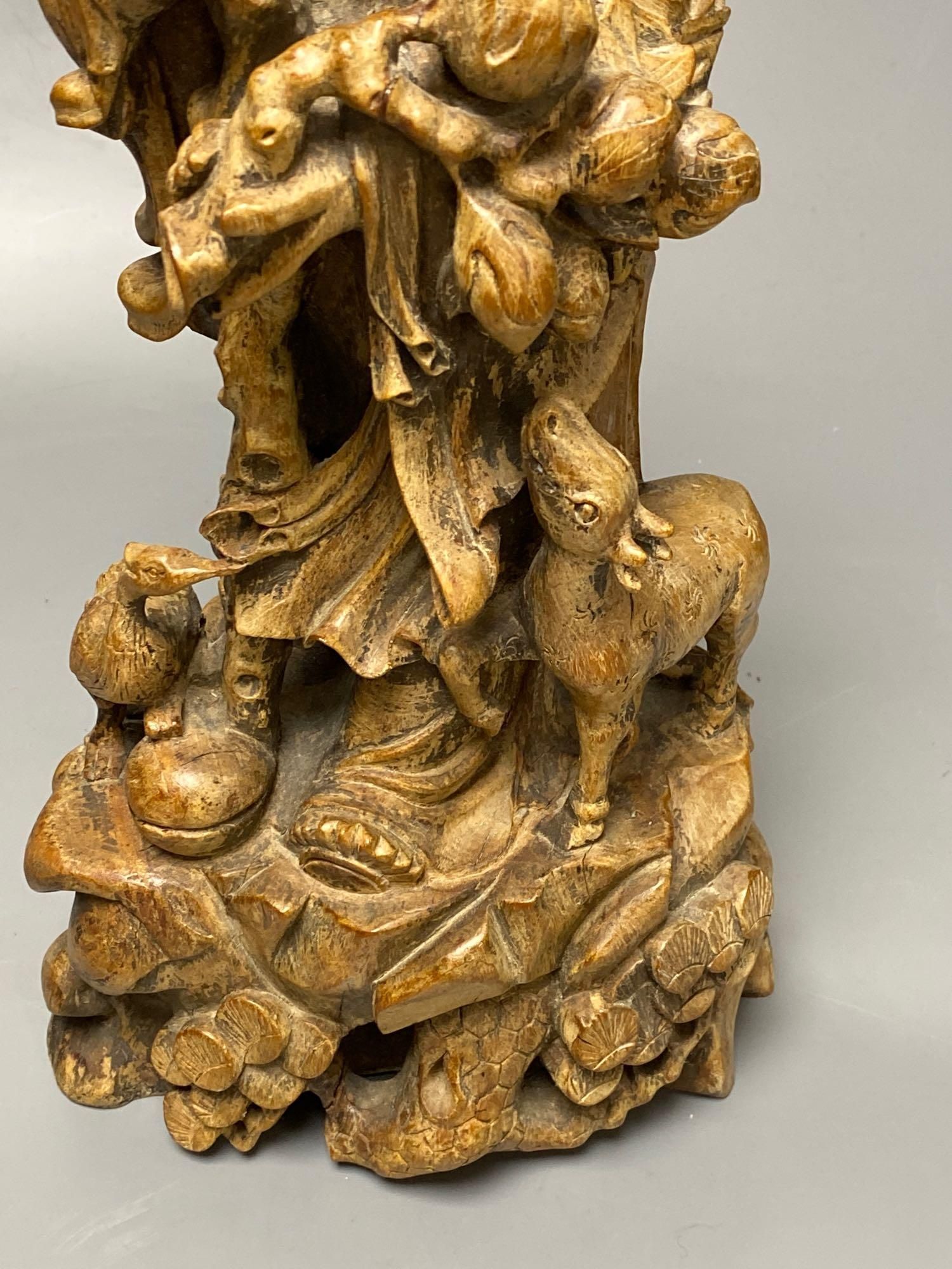 A Chinese carved hardwood figure of Shou Lao, 53cm